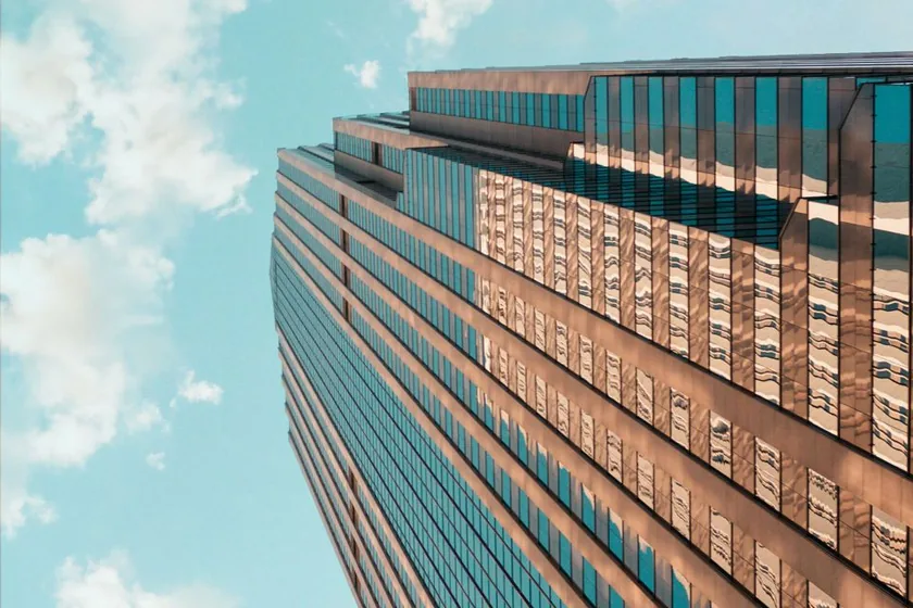 Glass office tower seen from below